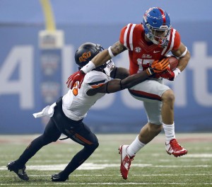 Mississippi tight end Evan Engram (17) carries as Oklahoma State safety Tre Flowers (31) tries to tackle in the first half of the Sugar Bowl college football game in New Orleans, Friday, Jan. 1, 2016. (AP Photo/Jonathan Bachman)