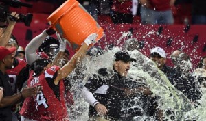 Falcons head coach Dan Quinn gets the infamous Gatorade bath.