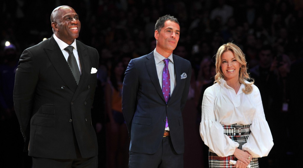 LOS ANGELES, CA - DECEMBER 18: (L-R) Magic Johnson, Rob Pelinka and Jeanie Buss attend Kobe Bryant's jersey retirement ceremony during a game between the Los Angeles Lakers and the Golden State Warriors at Staples Center on December 18, 2017 in Los Angeles, California.  (Photo by Allen Berezovsky/Getty Images)