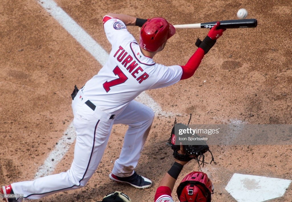 WASHINGTON, DC - SEPTEMBER 10: Washington Nationals shortstop Trea Turner (7) bunts during a MLB game between the Washington Nationals and the Philadelphia Phillies on September 10, 2017 at Nationals Park, in Washington DC. (Photo by Tony Quinn/Icon Sportswire via Getty Images)